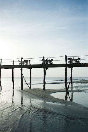 Pier with several dinner tables and chairs, Zanzibar, Tanzania Stock Photo - Premium Royalty-Free, Code: 695-03390572