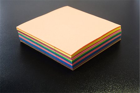 simsearch:649-05950266,k - Stack of multicolored paper, close-up Foto de stock - Sin royalties Premium, Código: 696-05780722