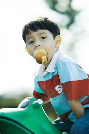 Child on playground equipment Stock Photo - Premium Royalty-Free, Code: 696-03394001