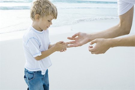 Father and son on beach Stock Photo - Premium Royalty-Free, Code: 696-03394019