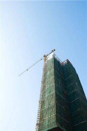 China, Guangdong Province, Guangzhou, high rise under construction Stock Photo - Premium Royalty-Free, Code: 696-03394720