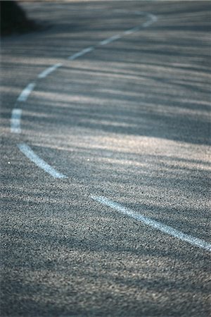 road backgrounds - Dividing line on asphalt, close-up Stock Photo - Premium Royalty-Free, Code: 696-03394845