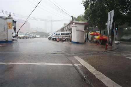 sad rainy day - Parking lot in rain Stock Photo - Premium Royalty-Free, Code: 696-03395049