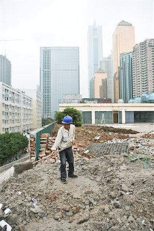 Worker in construction site Stock Photo - Premium Royalty-Free, Code: 696-03395141