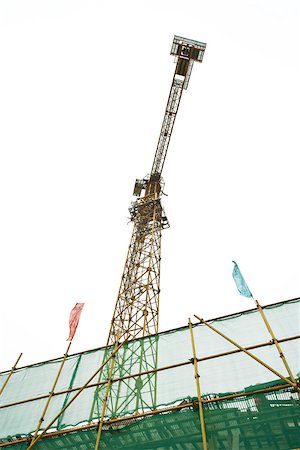 simsearch:632-01784566,k - Scaffolding and crane, low angle view Fotografie stock - Premium Royalty-Free, Codice: 696-03395160