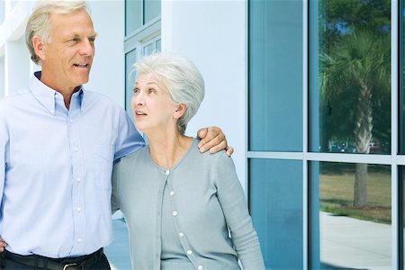 Mature couple walking together, both smiling, close-up Stock Photo - Premium Royalty-Free, Code: 696-03395247