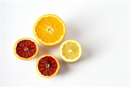 simsearch:696-03396170,k - Sliced orange, blood orange, and lemon, close-up Foto de stock - Royalty Free Premium, Número: 696-03395283