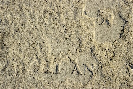 emerging - Gravestone, partially buried, extreme close-up Stock Photo - Premium Royalty-Free, Code: 696-03395345