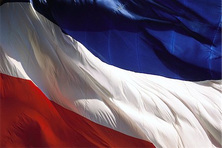 French flag rippling in wind, close-up, full frame Stock Photo - Premium Royalty-Free, Code: 696-03395390