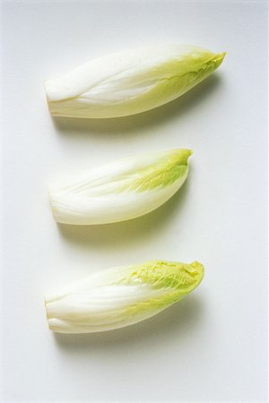 simsearch:696-03395288,k - Three endives, close-up Foto de stock - Sin royalties Premium, Código: 696-03395515