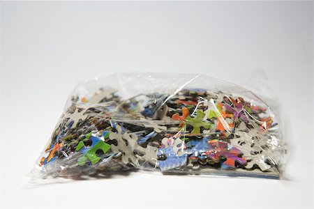 simsearch:696-03395596,k - Puzzle pieces in plastic bag, close-up Stock Photo - Premium Royalty-Free, Code: 696-03395605