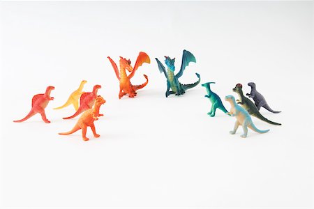 simsearch:696-03402888,k - Toy dinosaurs and dragons arranged by color, close-up Foto de stock - Sin royalties Premium, Código: 696-03395945