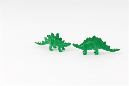 Two toy dinosaurs, face to face Foto de stock - Sin royalties Premium, Código: 696-03395942