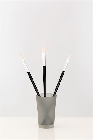 simsearch:696-03396044,k - Paint brushes sticking out of cup, close-up Stock Photo - Premium Royalty-Free, Code: 696-03395964