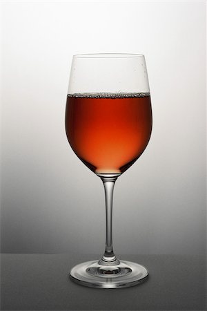 simsearch:695-03389906,k - Glass of rose wine, close-up Stock Photo - Premium Royalty-Free, Code: 696-03395988