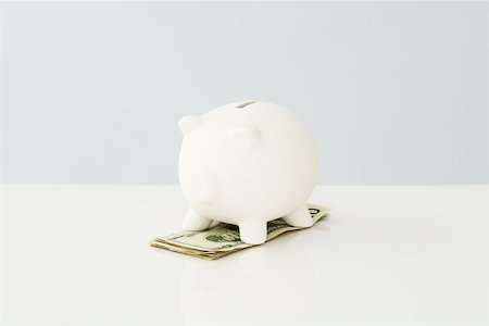 simsearch:696-03396044,k - Piggy bank on top of a small pile of twenty dollar bills Stock Photo - Premium Royalty-Free, Code: 696-03396045