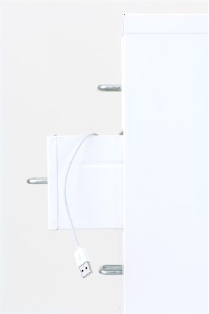 USB cable hanging from open drawer of a filing cabinet, close-up Foto de stock - Sin royalties Premium, Código: 696-03396055