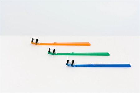 simsearch:696-03395851,k - Three toothbrushes, staggered and colorful Stock Photo - Premium Royalty-Free, Code: 696-03396060