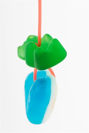 Candy hanging from string, close-up Foto de stock - Sin royalties Premium, Código: 696-03396096