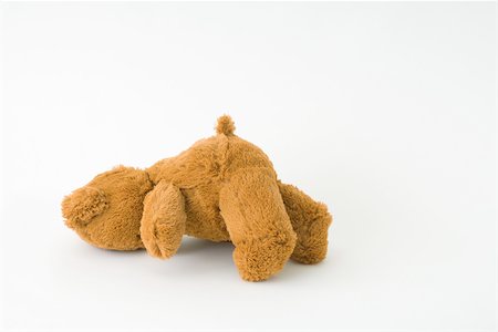 délaisser (laisser seul) - Ours en peluche couché à plat sur le sol Photographie de stock - Premium Libres de Droits, Code: 696-03396092