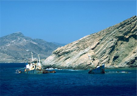 simsearch:696-03397610,k - Greece, fishing boats wrecked along rocky coast Stock Photo - Premium Royalty-Free, Code: 696-03396317