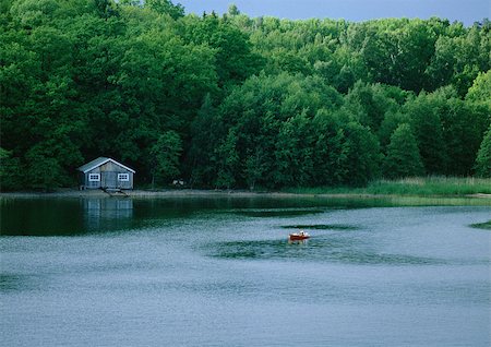 Finland, cabin at edge of lake Stock Photo - Premium Royalty-Free, Code: 696-03397174