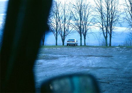 parking lot with trees - Car parked near water, view from another car. Stock Photo - Premium Royalty-Free, Code: 696-03397348