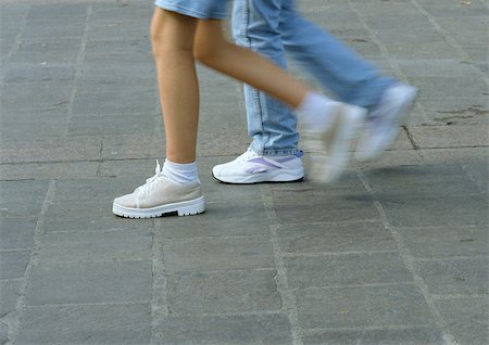 people walking tennis shoes - People walking, lower section, blurred motion Stock Photo - Premium Royalty-Free, Code: 696-03397414