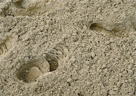 Footprints in sand, close-up Foto de stock - Sin royalties Premium, Código: 696-03397572