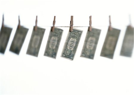 simsearch:693-06021294,k - Dollar bills hanging on clothesline Foto de stock - Sin royalties Premium, Código: 696-03397954