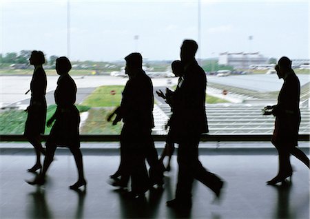 Group of people walking through concourse Stock Photo - Premium Royalty-Free, Code: 696-03397967