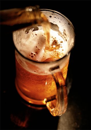 simsearch:695-05774838,k - Beer being poured into mug, high angle view, close-up Stock Photo - Premium Royalty-Free, Code: 696-03398151