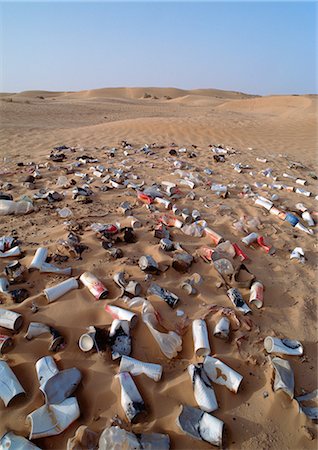 Garbage scattered over desert terrain Stock Photo - Premium Royalty-Free, Code: 696-03398436