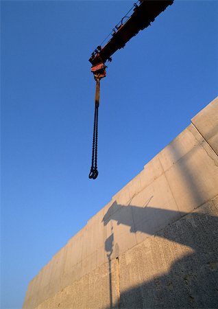simsearch:696-03398616,k - Crane and shadow on wall, low angle view Stock Photo - Premium Royalty-Free, Code: 696-03398602