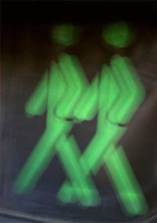 pictograph walking - Green pedestrian crossing light, close-up Stock Photo - Premium Royalty-Free, Code: 696-03398794