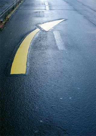 simsearch:6118-09144990,k - Directional arrow on road, close-up Stock Photo - Premium Royalty-Free, Code: 696-03398839