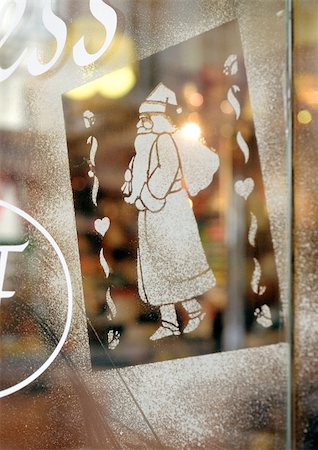 Santa Claus figure stenciled on window, close-up Stock Photo - Premium Royalty-Free, Code: 696-03398856
