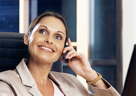Woman telephoning, portrait Stock Photo - Premium Royalty-Free, Code: 696-03398914