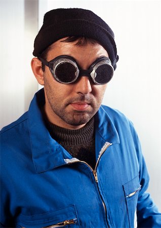 Man in coveralls wearing protective glasses, portrait Foto de stock - Sin royalties Premium, Código: 696-03399024