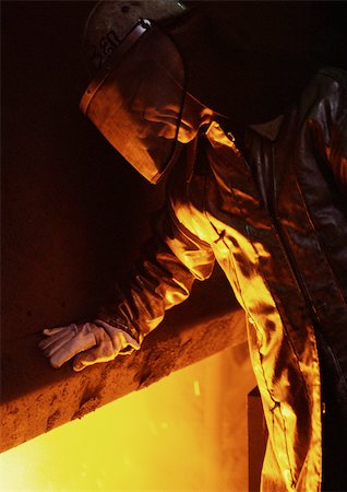 Man wearing protective suit and eyeshade Stock Photo - Premium Royalty-Free, Code: 696-03399041