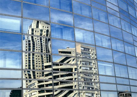 Building reflected in window panes Stock Photo - Premium Royalty-Free, Code: 696-03399103