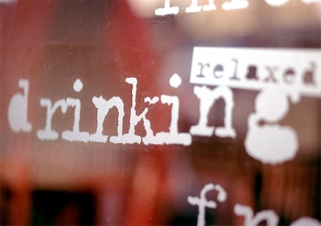 Relaxed, drinking text on window, close-up Stock Photo - Premium Royalty-Free, Code: 696-03399149
