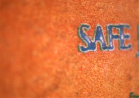Safe text on orange surface, close-up Stock Photo - Premium Royalty-Free, Code: 696-03399154