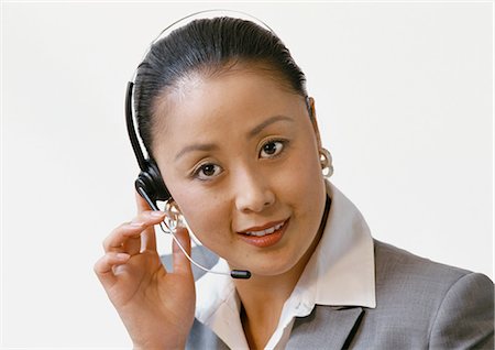 simsearch:400-04291703,k - Businesswoman wearing headset, portrait Stock Photo - Premium Royalty-Free, Code: 696-03399223