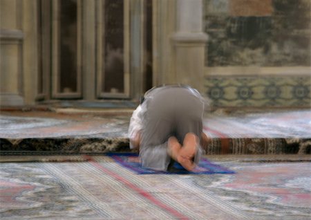 Israel, Jerusalem, Muslim man praying in mosque, rear view, blurred Stock Photo - Premium Royalty-Free, Code: 696-03399345