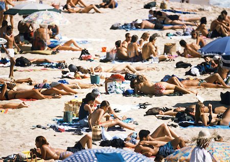 People on crowded beach, high angle view Stock Photo - Premium Royalty-Free, Code: 696-03399392