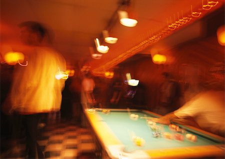 playing pool at a bar - People playing pool, blurred Stock Photo - Premium Royalty-Free, Code: 696-03399523