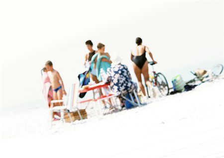 summertime picnic with family in the beach - Group of people on beach, blurred Stock Photo - Premium Royalty-Free, Code: 696-03399614