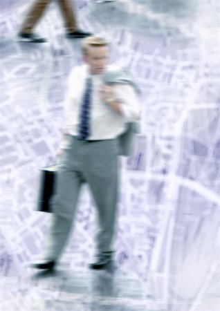 Businessman walking on city map, montage Stock Photo - Premium Royalty-Free, Code: 696-03399689