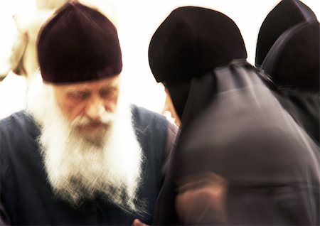 simsearch:695-03383556,k - Israel, Jerusalem, Orthodox priest and nun, close-up, blurry. Stock Photo - Premium Royalty-Free, Code: 696-03399752